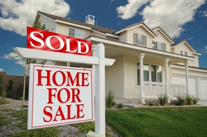 A house with a sold sign out front, emphasizing the VA Mortgage Benefits and Eligibility Guide.